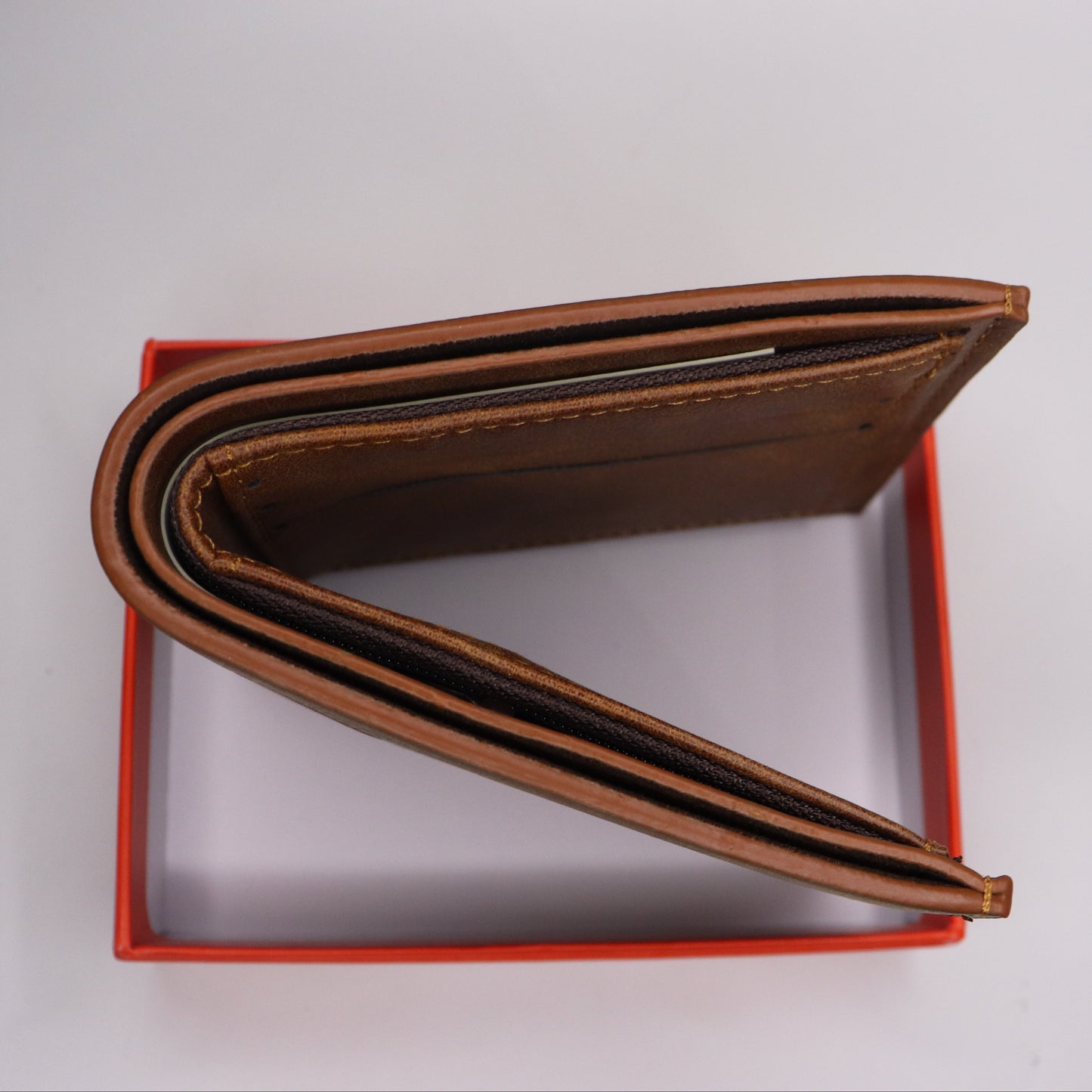 Brown leather wallet with 'DOUX STYLE' branding