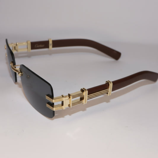 Gold-framed sunglasses with dark lenses