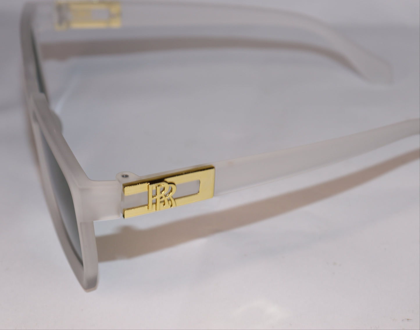 Sunglasses with green lenses and beige frames