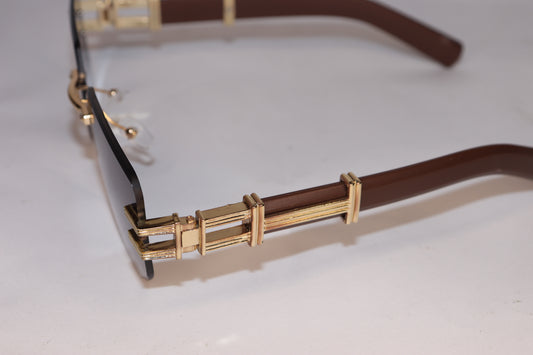 Gold-framed sunglasses with brown lenses