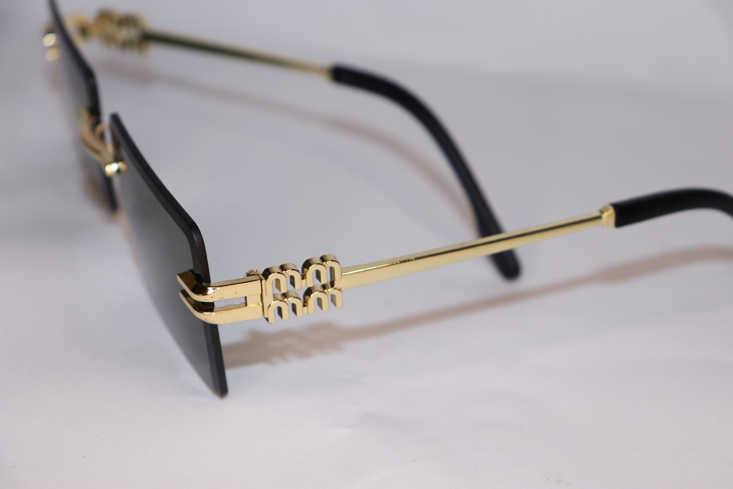 Glasses with gold frame and black arms