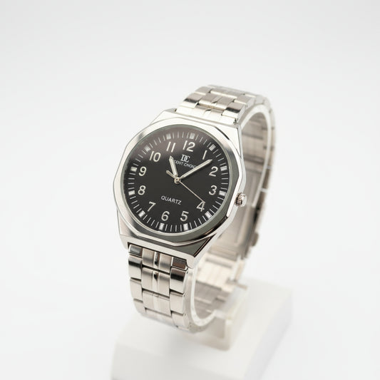 Silver watch with a black face on a light gray background