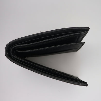 Black wallet on a metallic surface