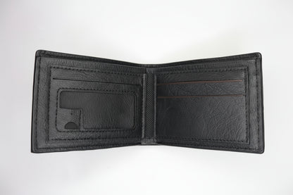 Black wallet on a metallic surface