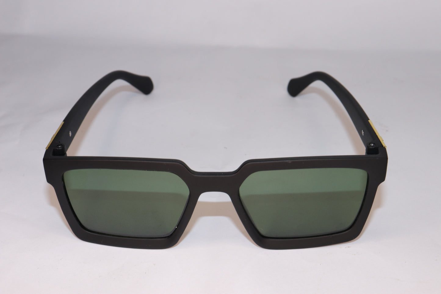 Black sunglasses with green lenses