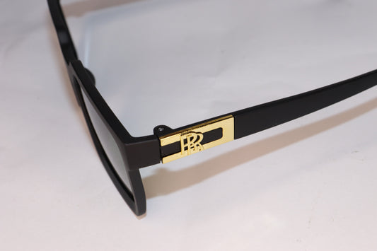 Black sunglasses with green lenses