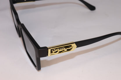 Black sunglasses with gold accents