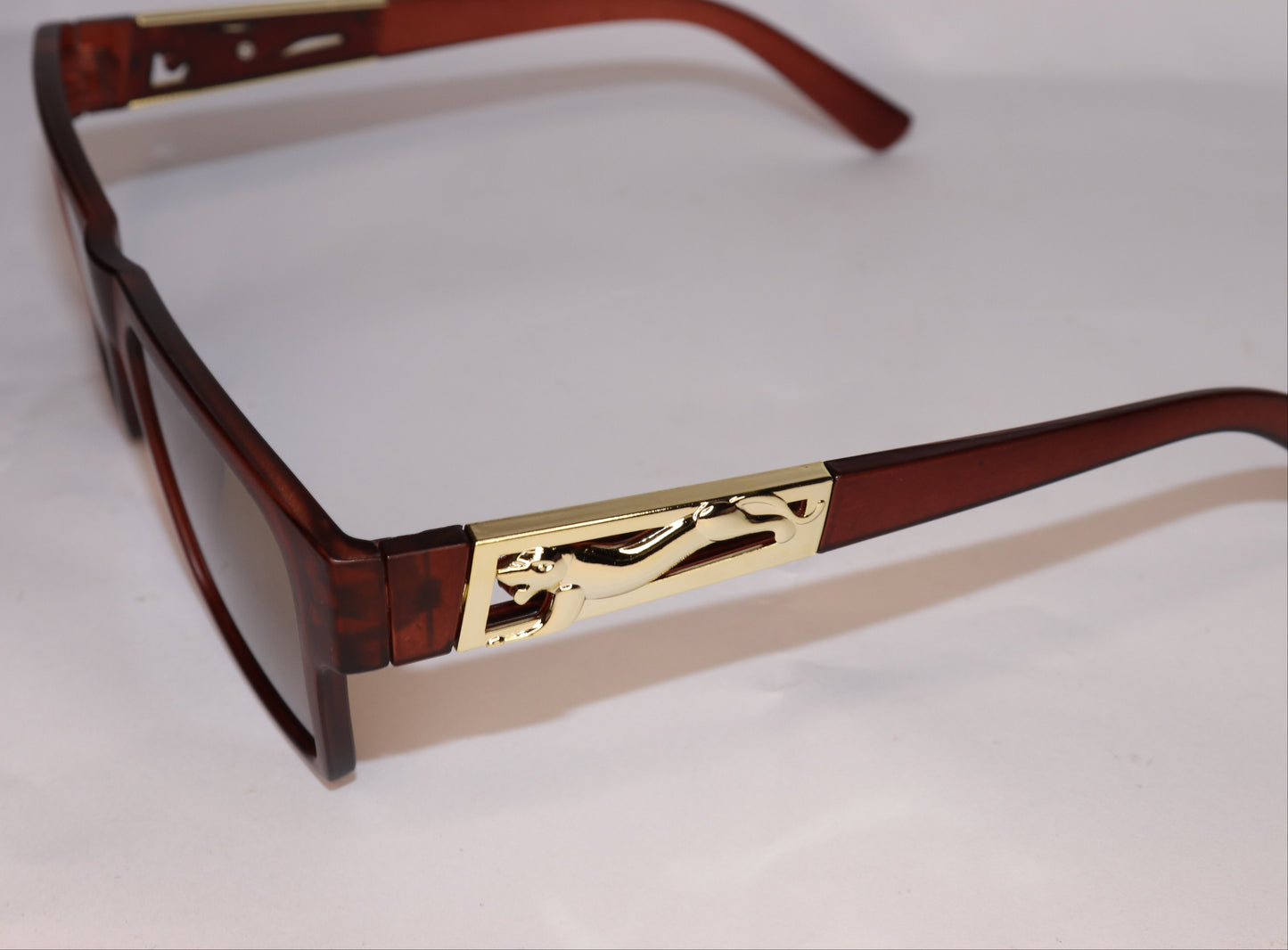 Brown sunglasses with 'BOSTON' branding