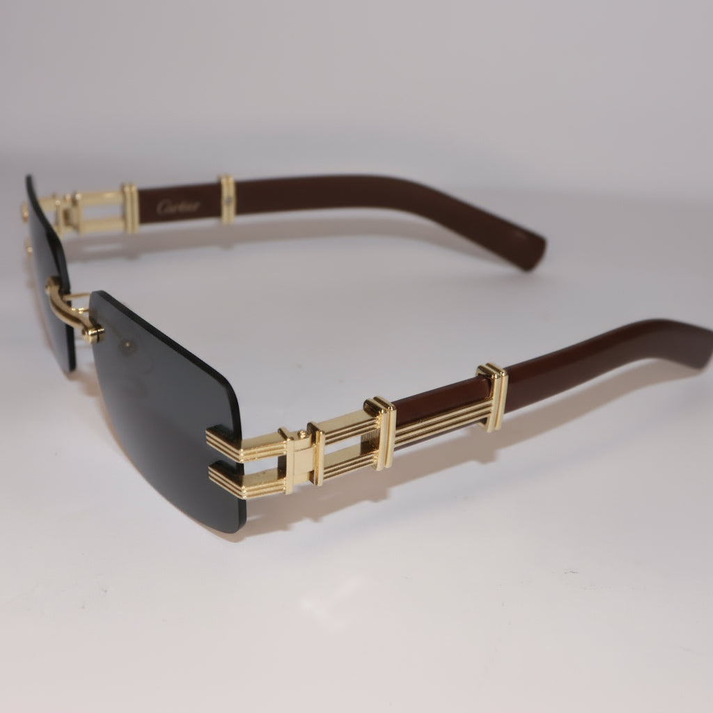 Gold-framed sunglasses with dark lenses