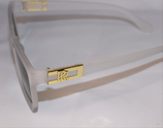 Sunglasses with green lenses and beige frames