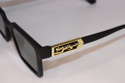 Black sunglasses with gold accents