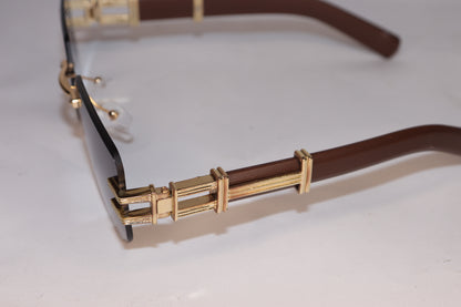 Gold-framed sunglasses with brown lenses