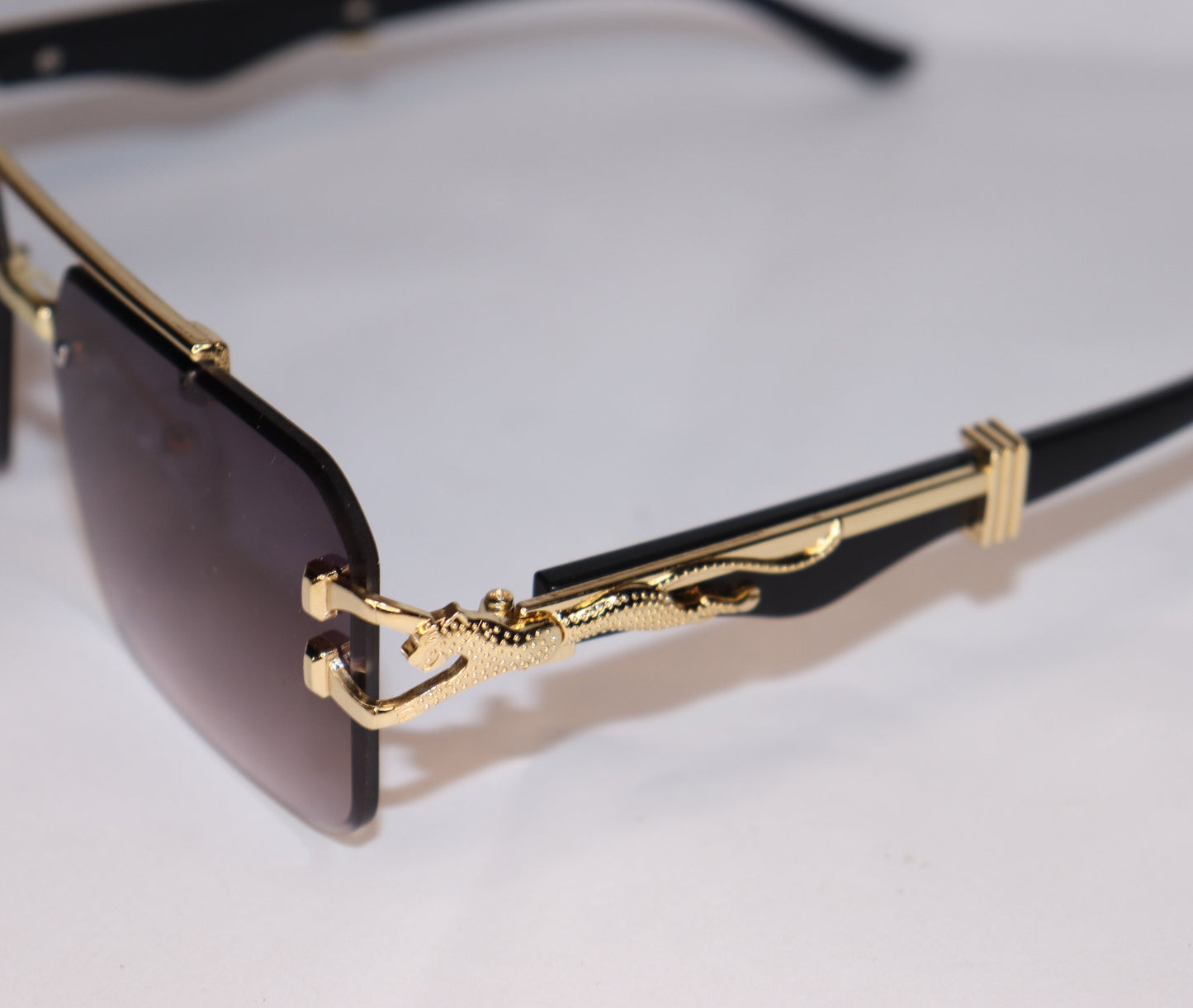 Gold-framed sunglasses with gradient lenses