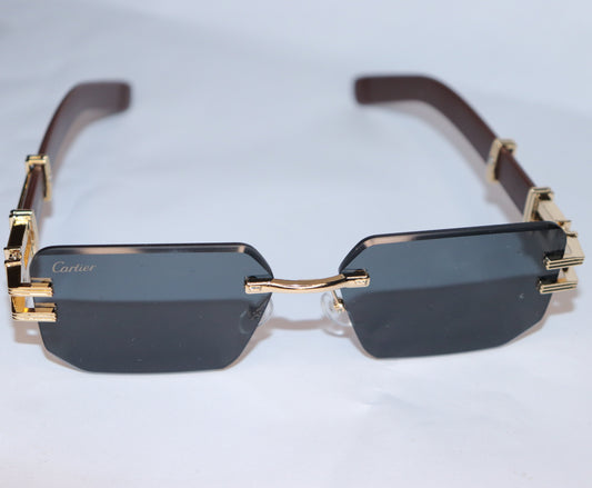 Gold-framed sunglasses with dark lenses
